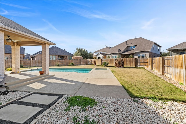 view of pool featuring a patio area, a yard, and ceiling fan