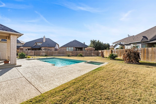 view of pool featuring a lawn and a patio