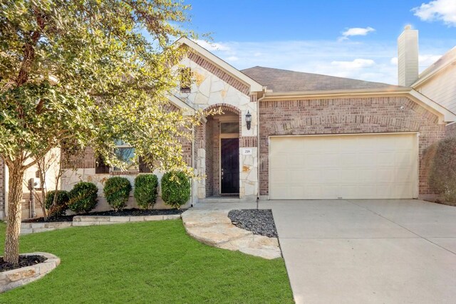 view of front facade with a garage and a front yard