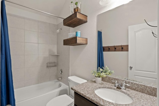 bathroom with shower / tub combo, vanity, and toilet