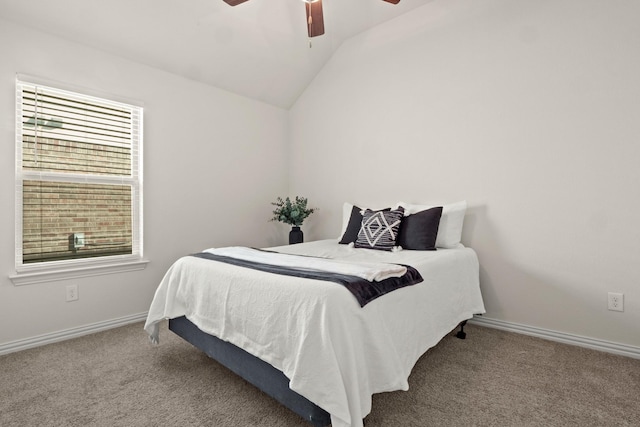 carpeted bedroom featuring multiple windows, lofted ceiling, and ceiling fan