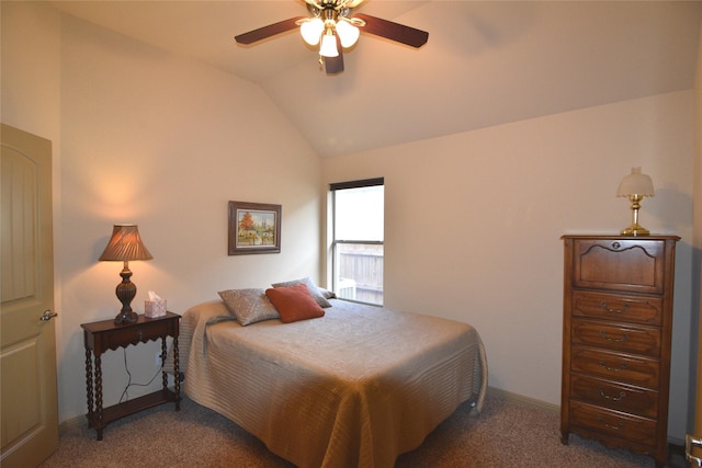 bedroom featuring ceiling fan, vaulted ceiling, and dark carpet