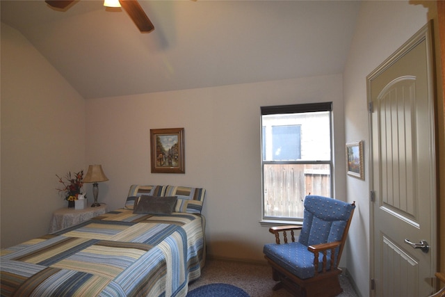 bedroom with ceiling fan, lofted ceiling, and multiple windows