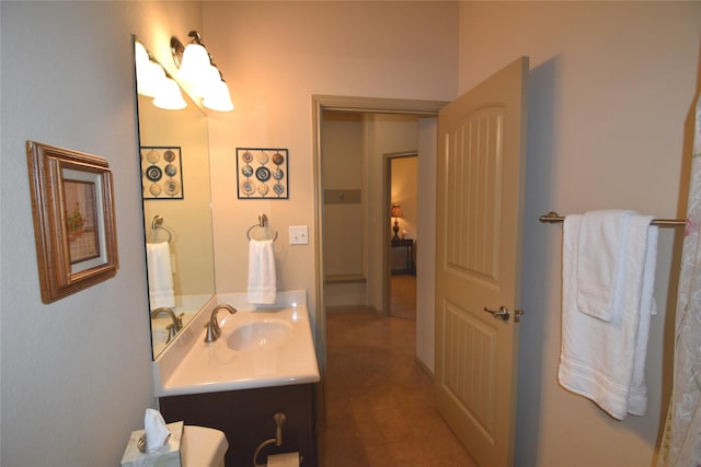 bathroom with vanity and a notable chandelier