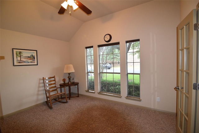 unfurnished room with ceiling fan, vaulted ceiling, and carpet flooring