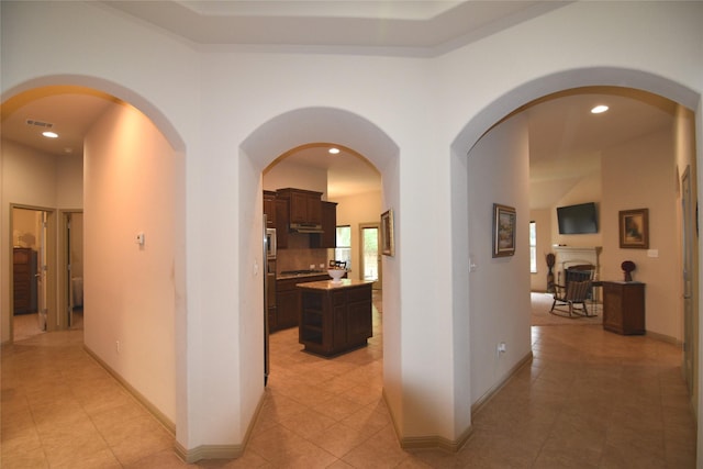 hall featuring light tile patterned flooring