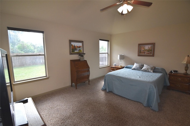 bedroom with ceiling fan, carpet, and lofted ceiling