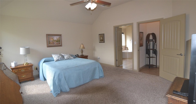 carpeted bedroom with ceiling fan, ensuite bathroom, and vaulted ceiling