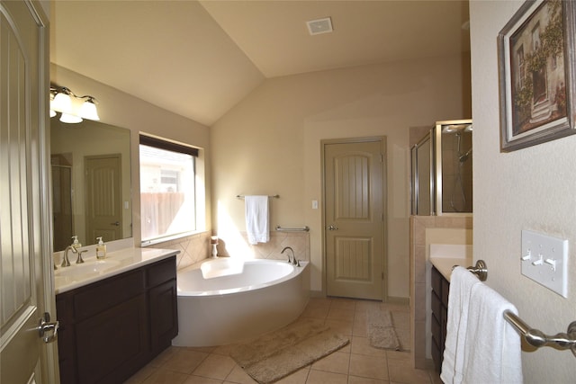 bathroom featuring lofted ceiling, vanity, independent shower and bath, and tile patterned floors