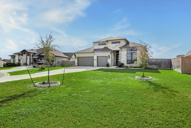 view of front of home with a garage and a front yard