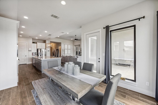 dining room featuring ceiling fan, a healthy amount of sunlight, and sink