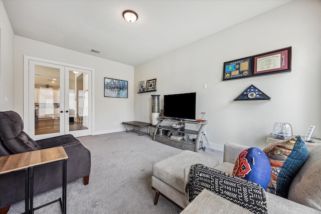 living room featuring carpet and french doors