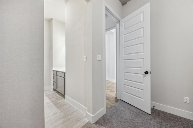 corridor with light wood-type flooring