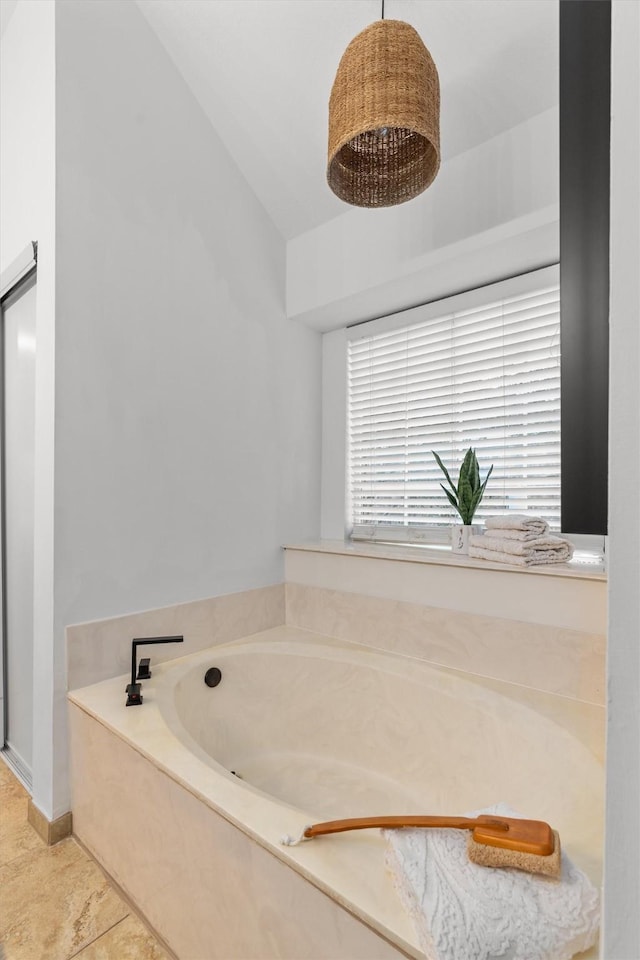 bathroom featuring a bathtub and tile patterned flooring