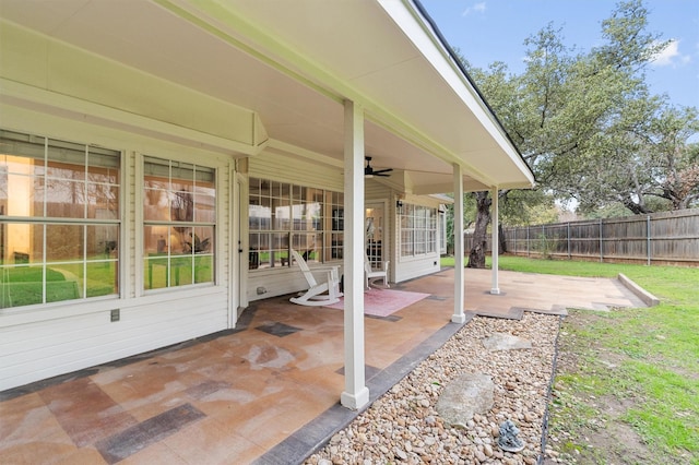 view of patio featuring ceiling fan