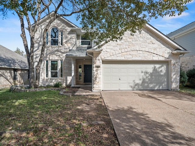 view of front of home featuring a front yard and a garage