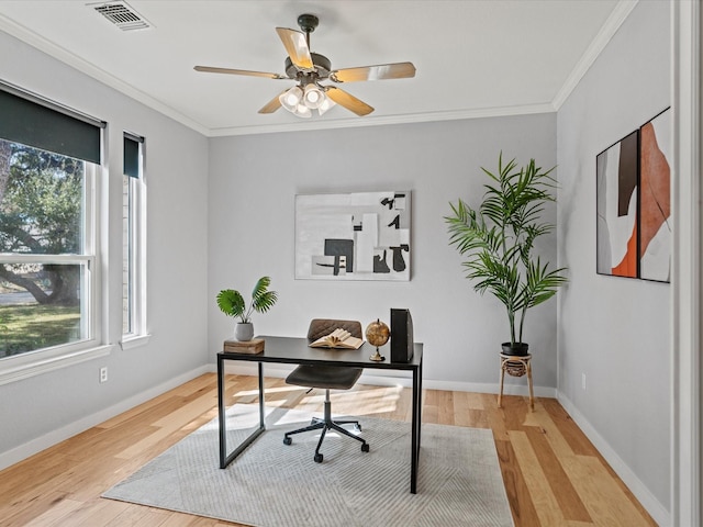 office area with ceiling fan, a healthy amount of sunlight, light wood-type flooring, and crown molding