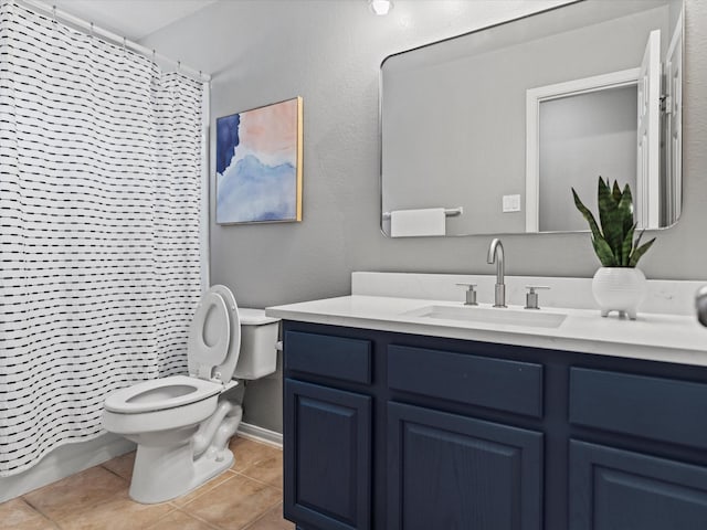 bathroom featuring toilet, a shower with shower curtain, tile patterned floors, and vanity