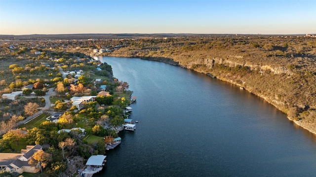 aerial view at dusk with a water view