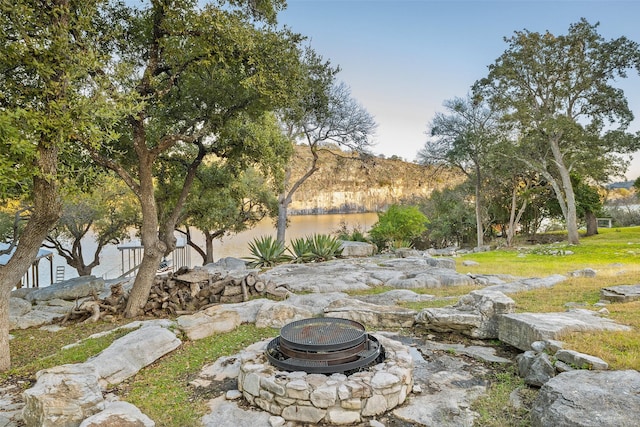 view of yard with an outdoor fire pit