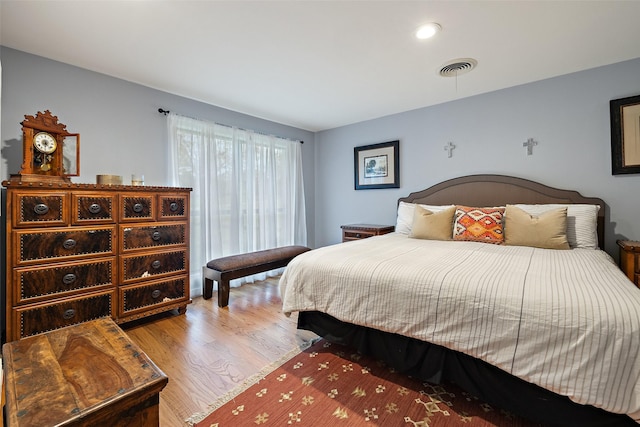 bedroom with light hardwood / wood-style flooring