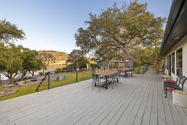 wooden terrace with a yard