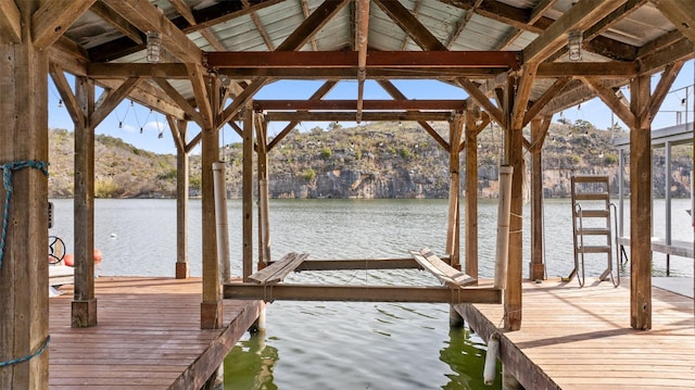 view of dock featuring a water and mountain view