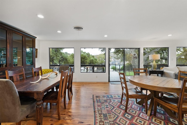 dining space featuring light wood-type flooring