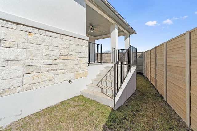 exterior space featuring ceiling fan