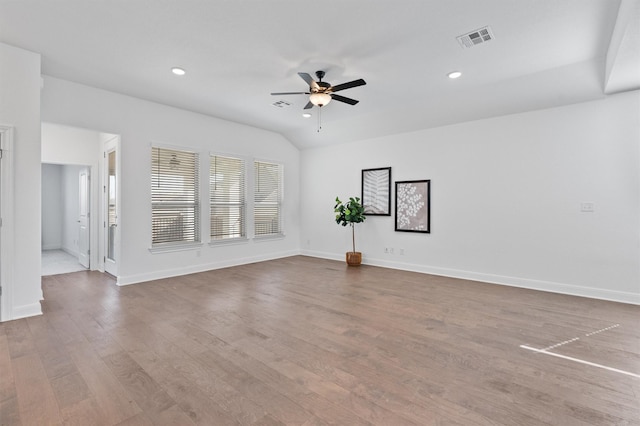 unfurnished room with light wood-type flooring, ceiling fan, and lofted ceiling