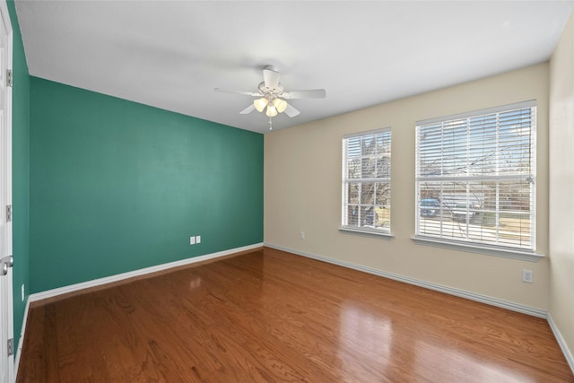 empty room featuring light hardwood / wood-style floors and ceiling fan