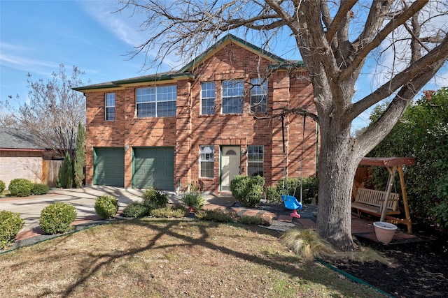 view of front of property with a front yard and a garage