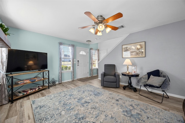 sitting room featuring ceiling fan and hardwood / wood-style floors