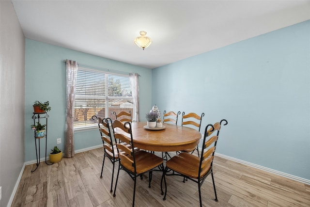 dining area with light wood-type flooring