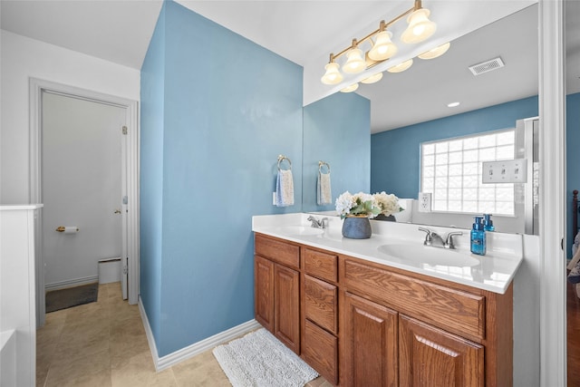 bathroom featuring tile patterned flooring and vanity