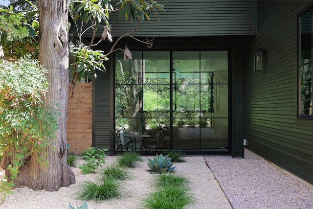 doorway to property with a patio area