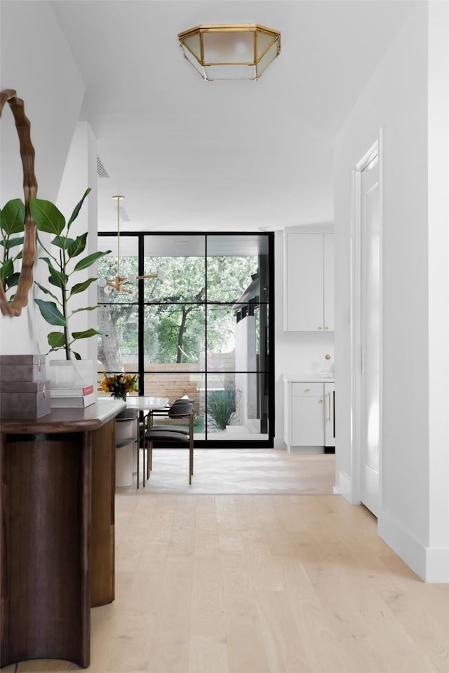 hall featuring light wood-type flooring