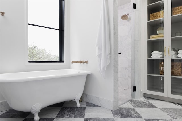 bathroom with separate shower and tub