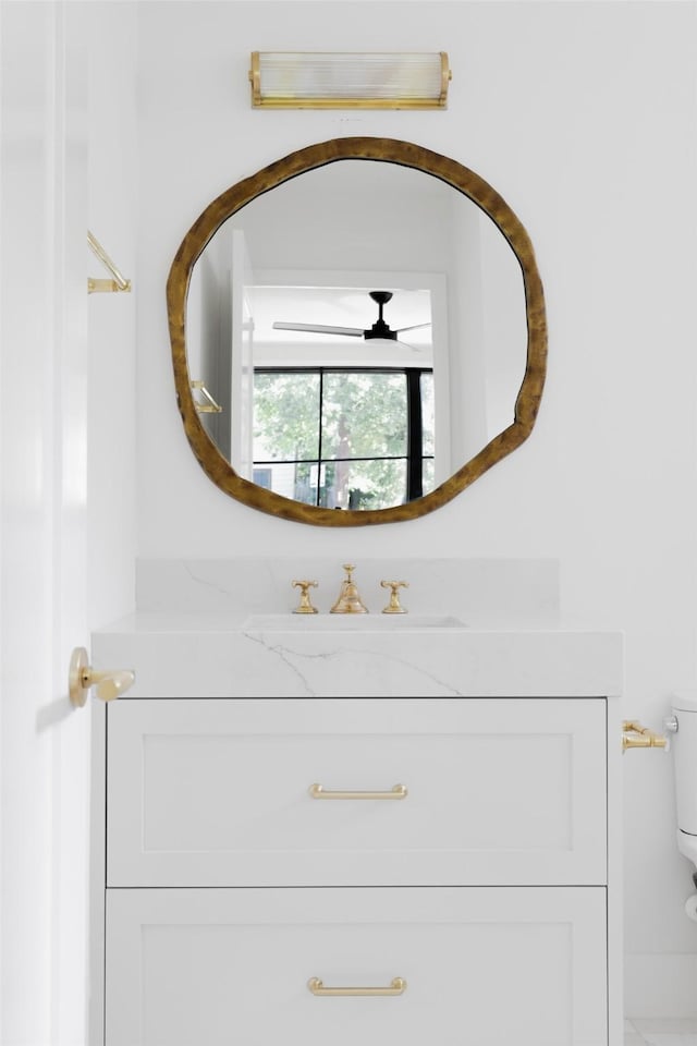 bathroom with toilet and vanity