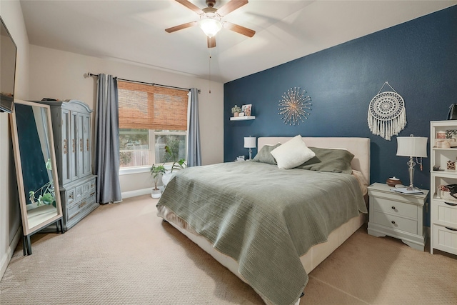 bedroom featuring ceiling fan and light colored carpet