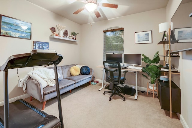 office space featuring ceiling fan and light colored carpet