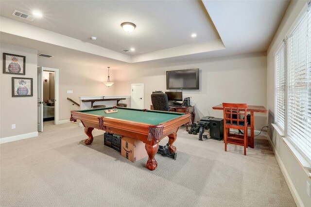 game room with light colored carpet, a tray ceiling, and pool table