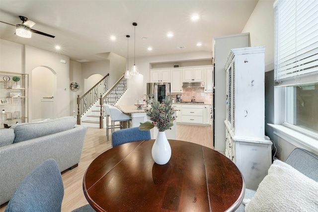 dining room featuring light wood-type flooring and ceiling fan