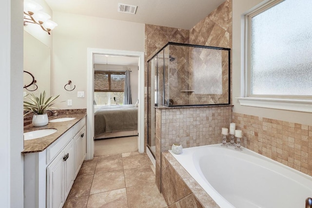4408 Trinity Woods St, Leander, TX 78641 - full bathroom featuring ensuite bathroom, a garden tub, a shower stall, and double vanity