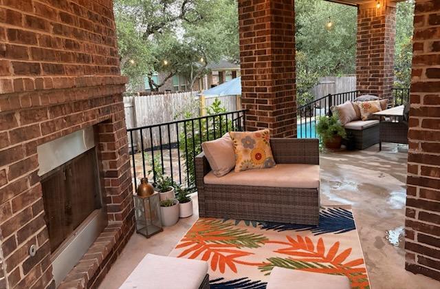 4408 Trinity Woods St, Leander, TX 78641 - balcony with an outdoor living space with a fireplace