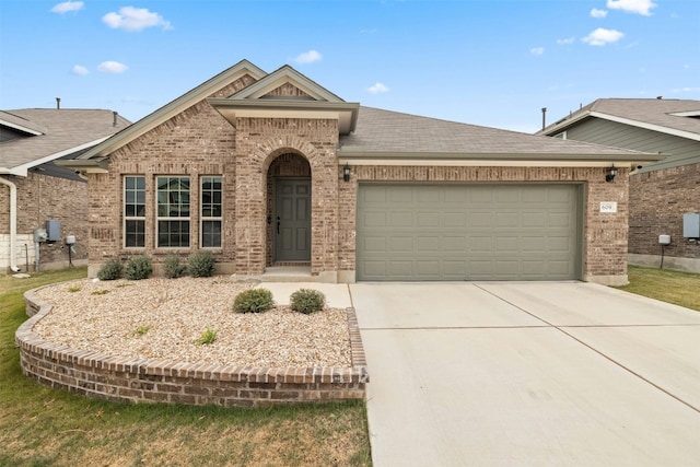 view of front of property with a garage, brick siding, roof with shingles, and concrete driveway