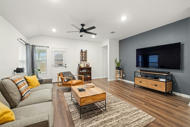 living area with visible vents, wood finished floors, recessed lighting, baseboards, and vaulted ceiling