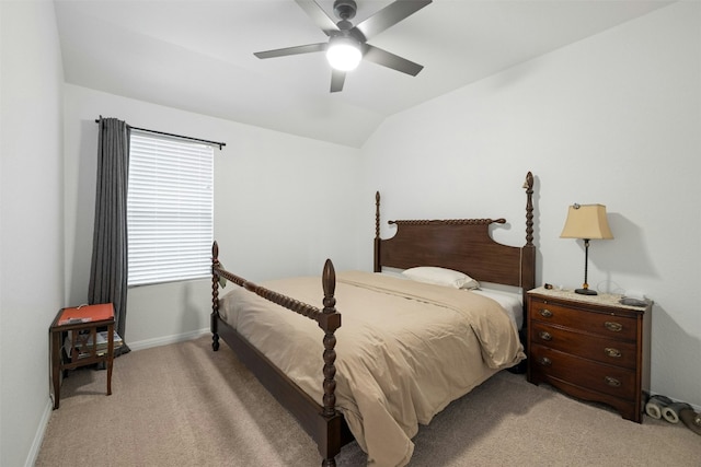 bedroom featuring baseboards, light carpet, a ceiling fan, and vaulted ceiling