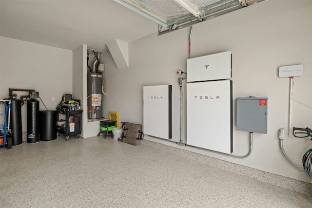 garage with fridge, water heater, and freestanding refrigerator