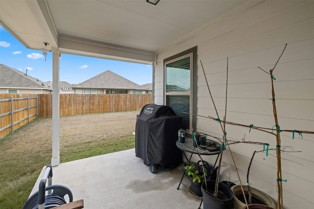 view of patio / terrace with area for grilling and a fenced backyard